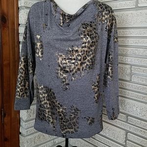 Knit long sleeve drape neck top.